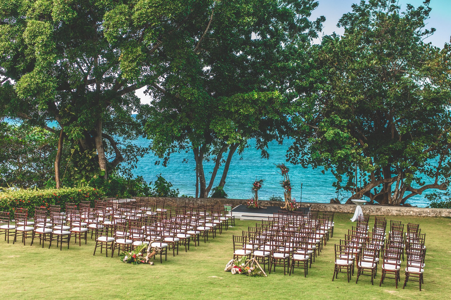Real Jamaica ocean-view wedding ceremony beneath tropical trees
